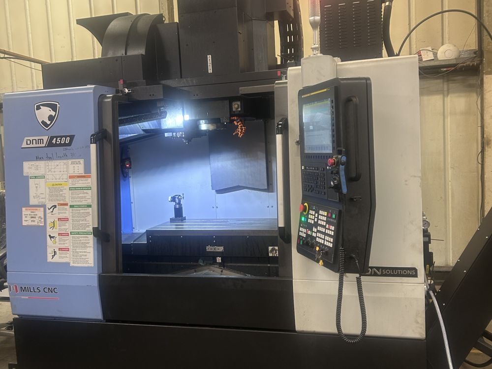 DNM 4500 vertical machining centre with its work light on
